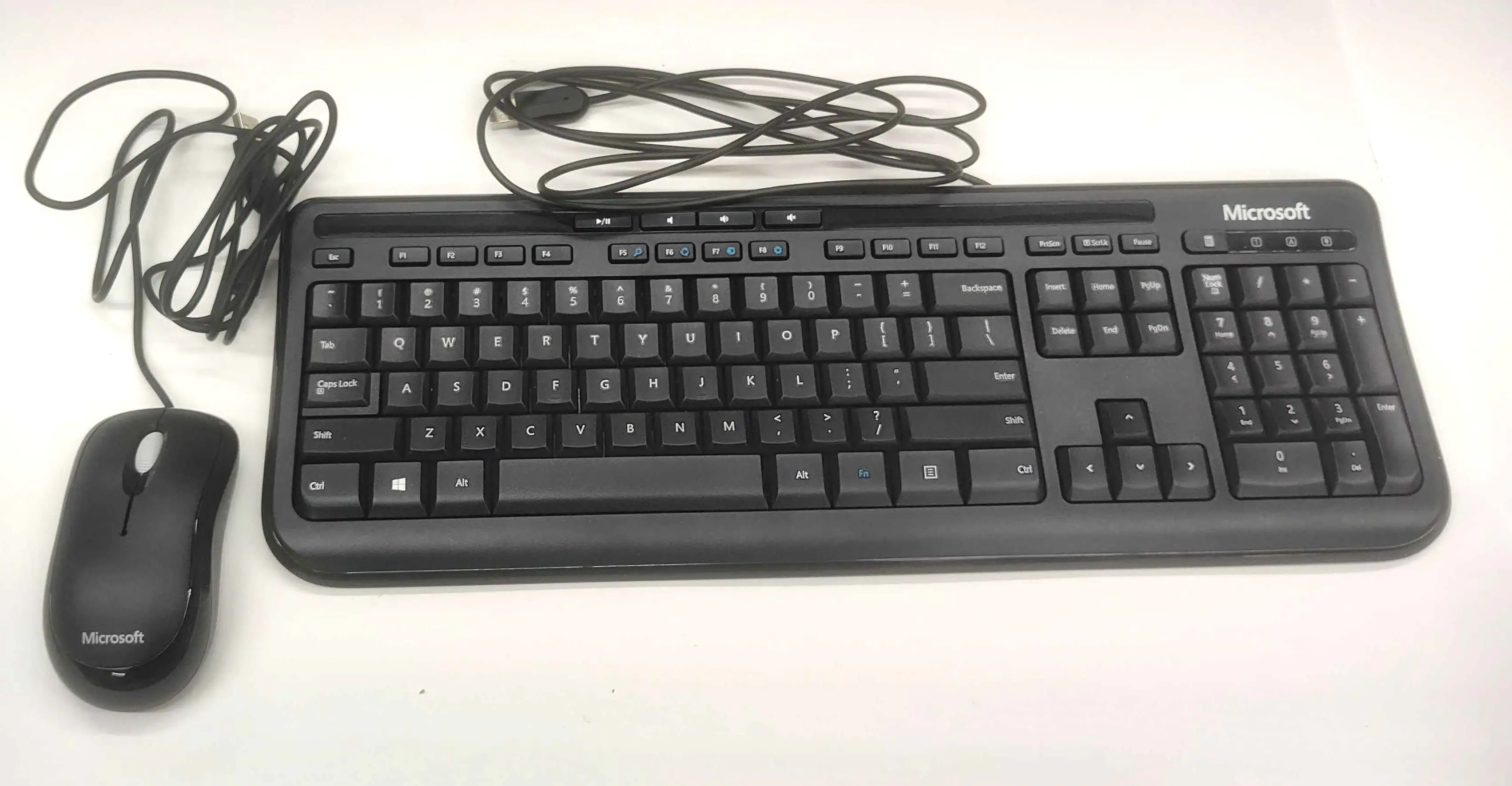 Sure, here is the corrected and grouped text from the image:

---

Microsoft

/E A . + Microsoft - F2 F3 Me F FS 1 P i FO F PU Priam Sula Tate - Tab Caps Lock Shift I 1 Q A . 2 W S Z . 3 x E D 5 4 C R F % s T G V A 6 Y H & 7 U J N 8 I M E 9 K 3 0 o L A P A I : { I ? / - . 1 Badispace I / Eriter Shift Snoert Delete Home Plip End PyDn A - Cok - 7 8 - 4 5 4 1 2 - - - 9 4 -r 6 . 3 Ae Enter Co Alt Alt Fn Ctri < > 0 - DE Microsoft

---

This text appears to be a mix of random characters and words, possibly from a keyboard layout or a creative text arrangement.