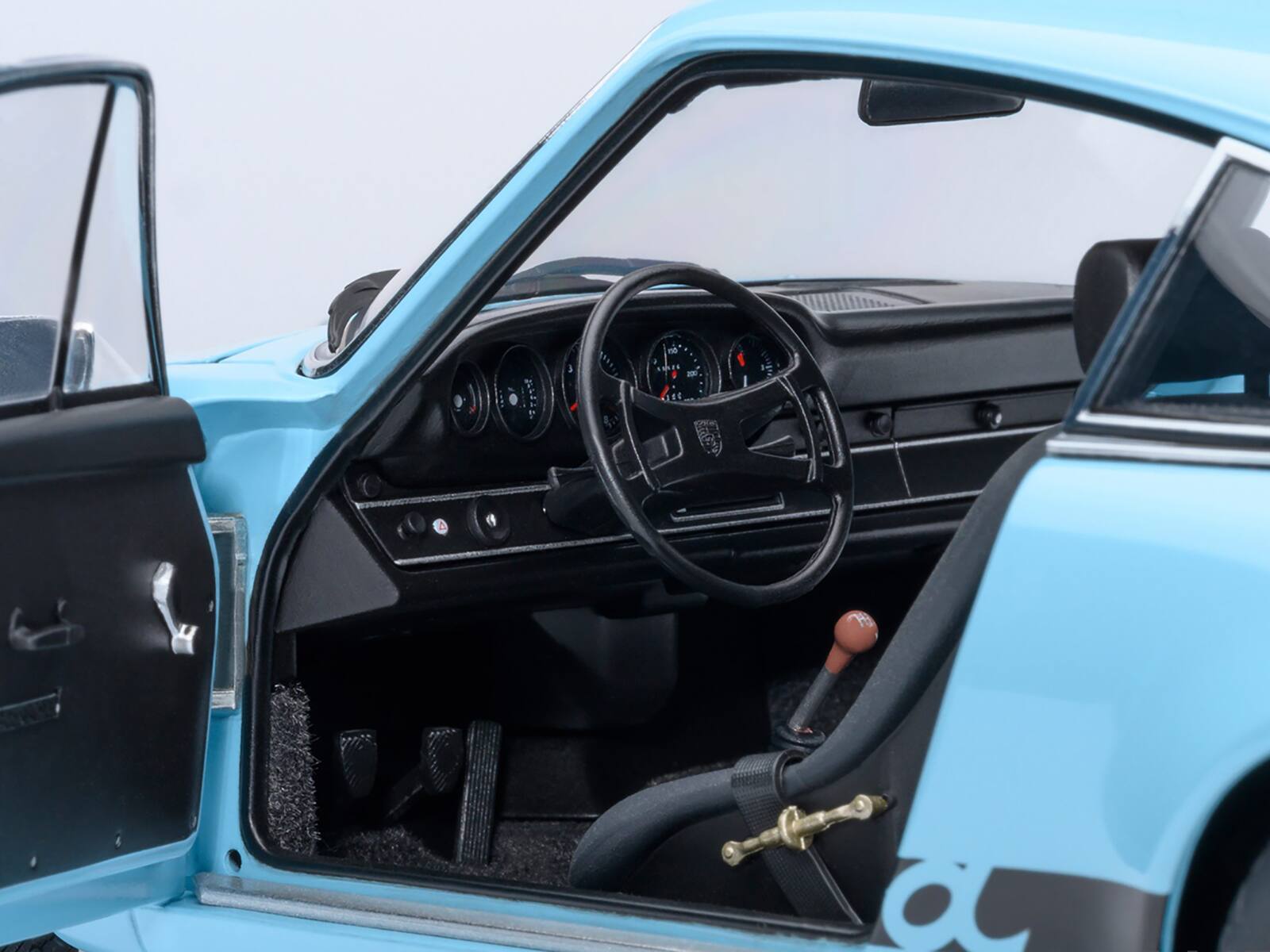 Left. Autoart - Porsche 911 Carrera 2.7 RS Gulf Blue with Black Stripes and Wheels 1/18 Model Car by Autoart - Blue with Black Stripes.