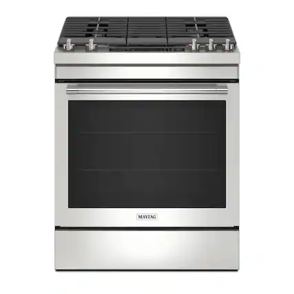 The image features a stainless steel oven with a black door, manufactured by Maytag. The oven has a silver handle and is designed to be built into a kitchen cabinet. The door is currently open, revealing the empty interior of the oven.