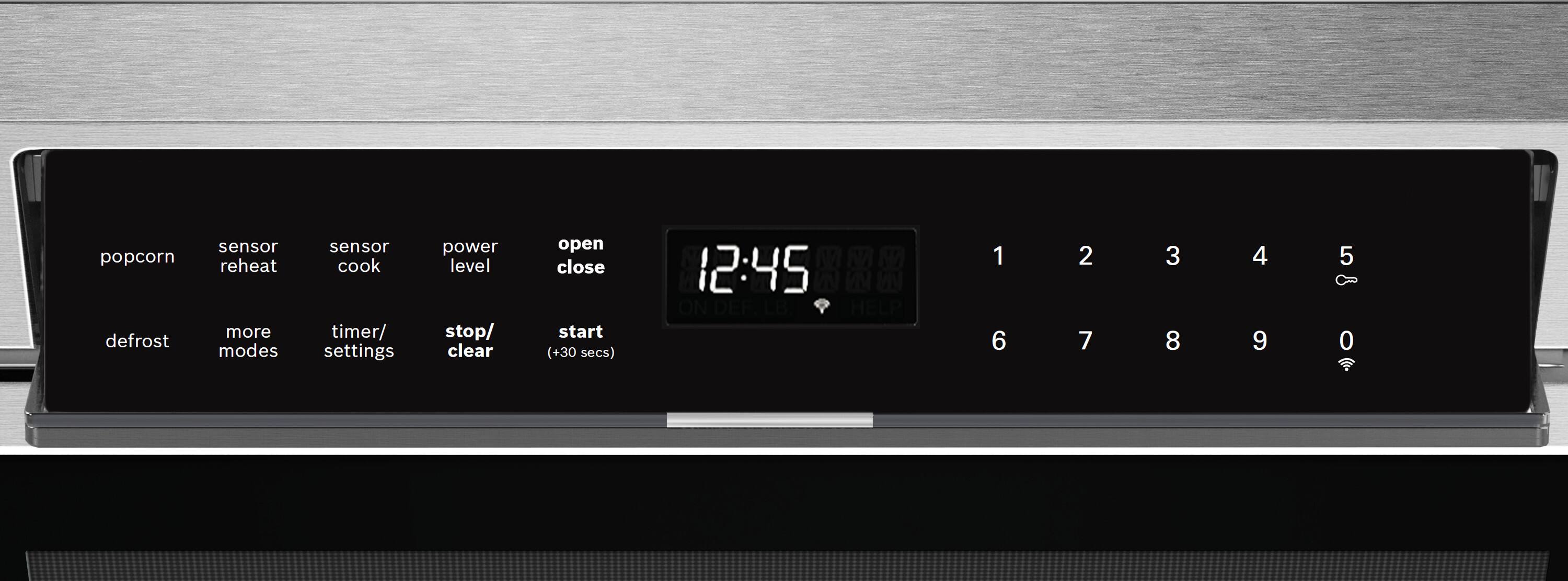The text on the image reads:

Popcorn defrost sensor reheat more modes sensor cook timer/settings power level stop/clear open close start (+30 secs) M M M 12:45 W W ON DEF LB HELP 1 6 2 7 3 8 4 9 5 0

The corrected text should be:

Popcorn defrost sensor reheat more modes sensor cook timer/settings power level stop/clear open close start (+30 secs) M M M 12:45 W W ON DEF LB HELP 1 6 2 7 3 8 4 9 5 0

There are no errors in the text, and it is correctly grouped.