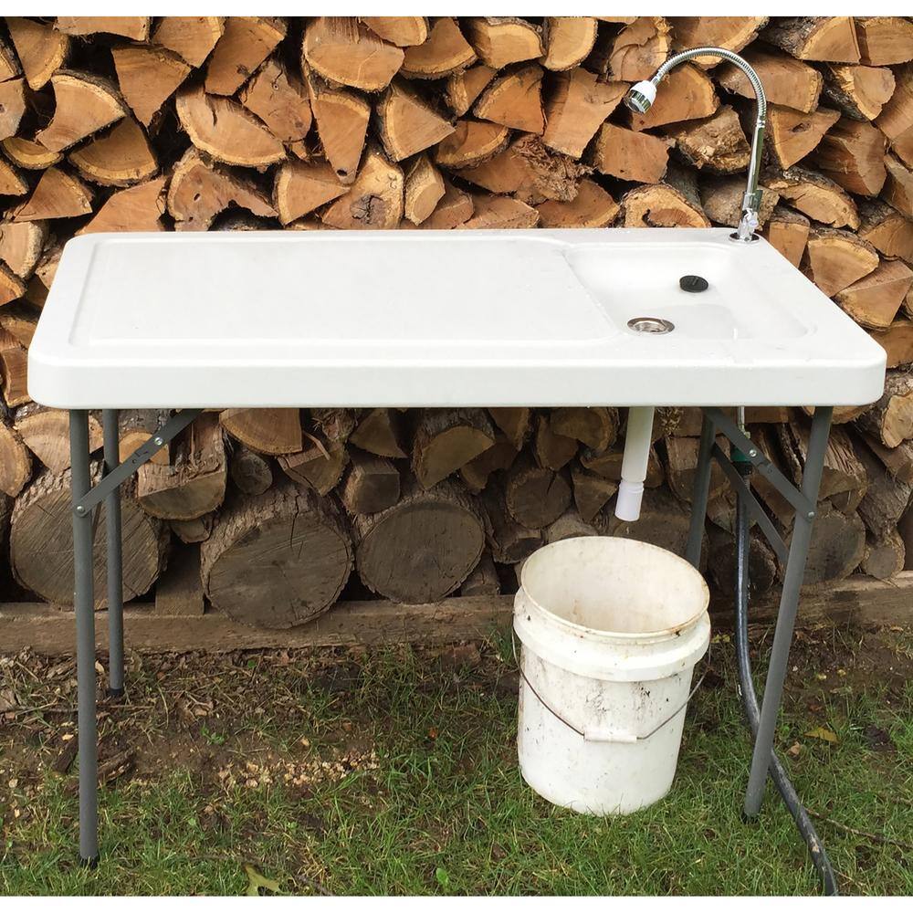 Left. Sportsman Pro-Series - Folding Fish Table With Faucet - White.