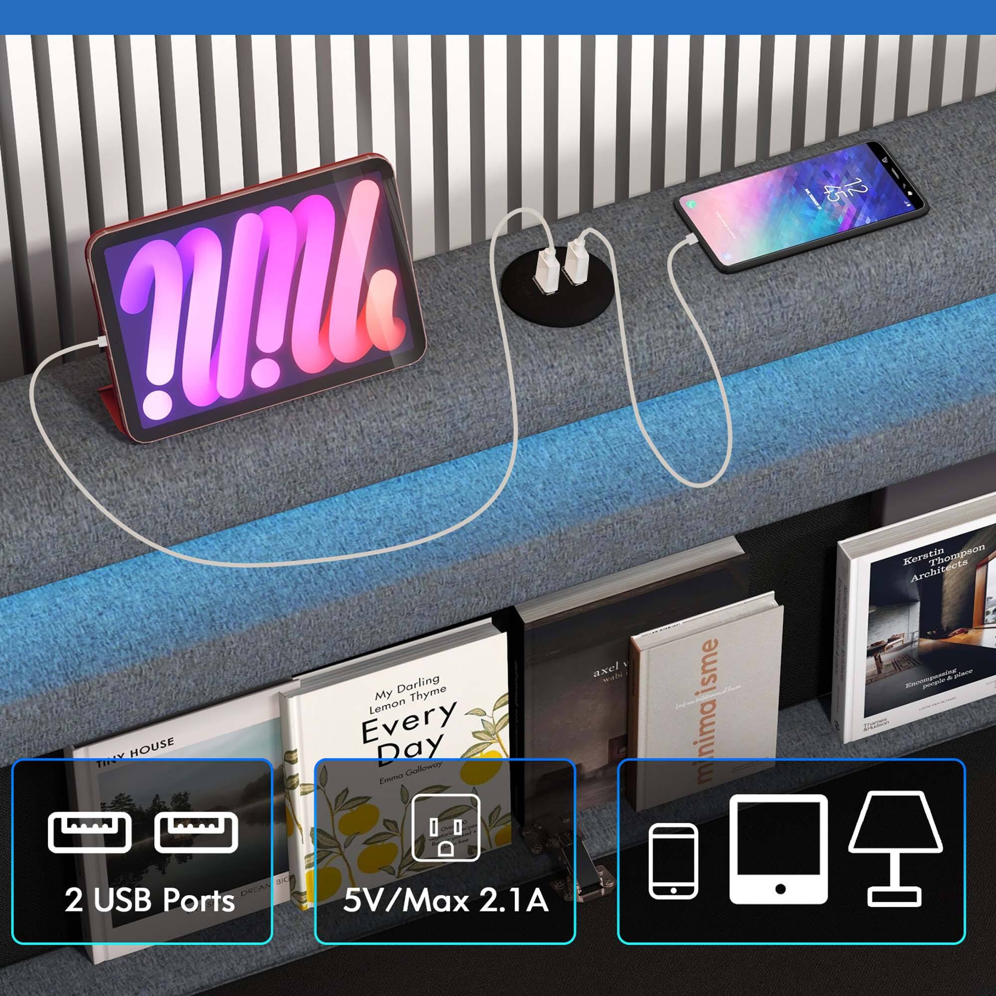 The image features a blue shelf with a variety of items on it, including a laptop, a cell phone, and a pair of headphones. There are also several books arranged on the shelf. The headphones are connected to the laptop, and the cell phone is placed nearby. The shelf is situated in front of a wall, and there is a bench in the background. The image is likely promoting a product or showcasing a workspace setup.