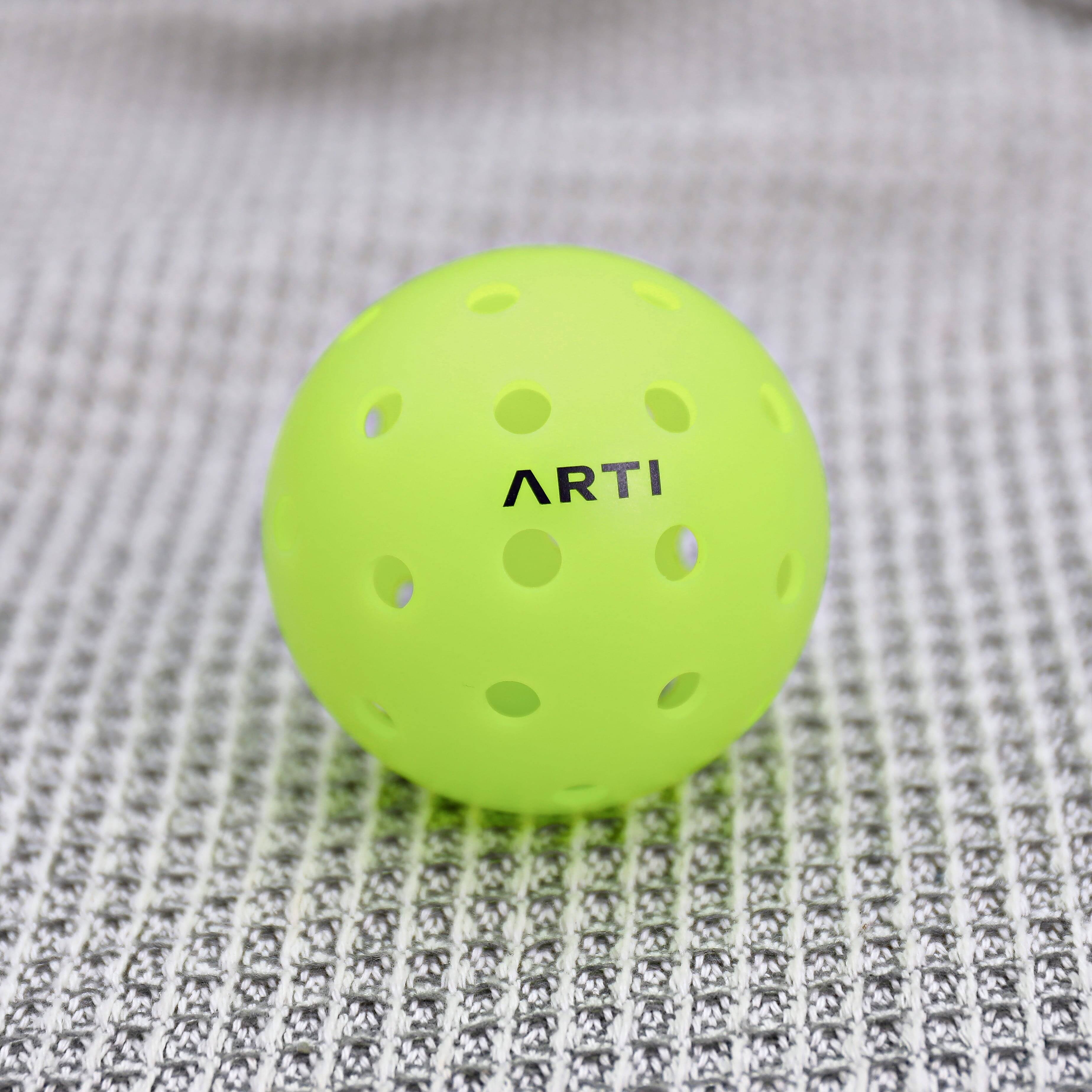 Left. ARTI - ARTI Outdoor Pickleballs 3-Pack, Neon Green - Neon Green.