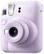The image features a pink Instax Mini 12 camera with a 50mm lens. The camera has a focus range of 0.3m to 0.3m, which is suitable for capturing close-up shots. The camera is designed for instant photography, making it a popular choice for those who enjoy taking quick and easy photos.