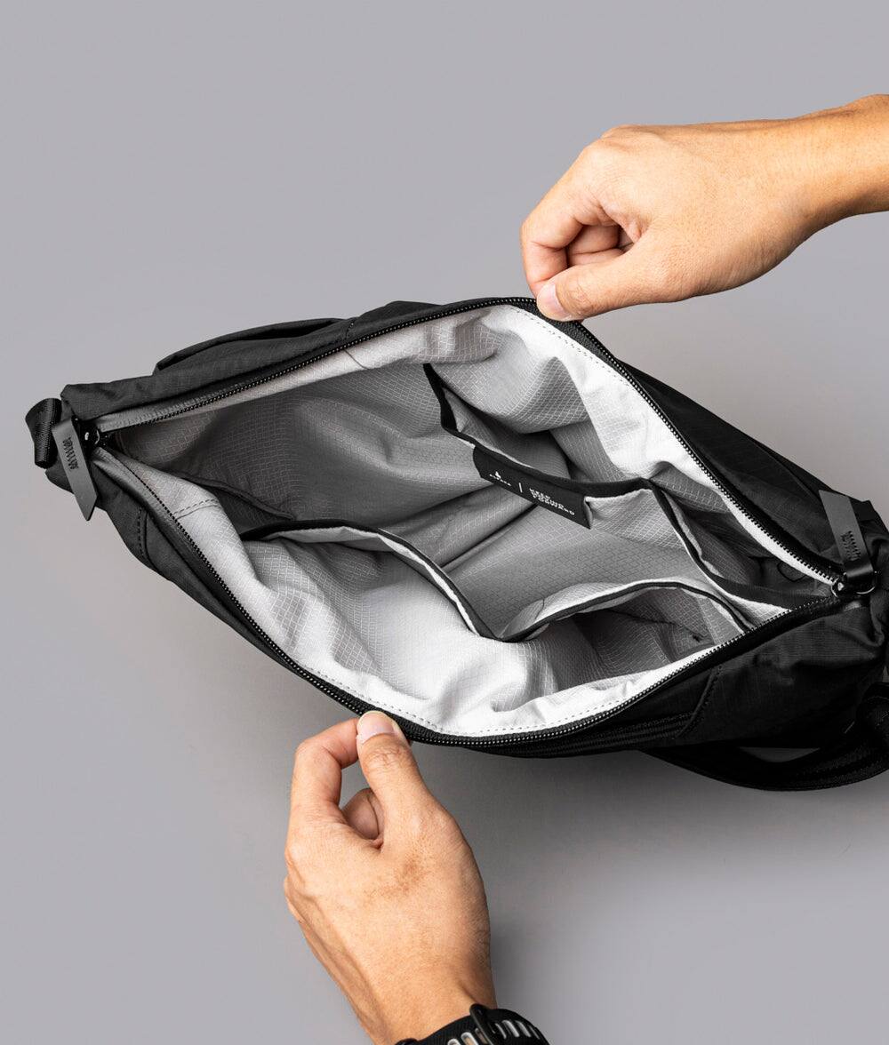 Alt View 4. ALPAKA - Flow Satchel 4L Crossbody Bag, Water Resistant Shoulder Bag, Expandable Bottle Pocket, YKK Zippers - Black Axoflux 210D.