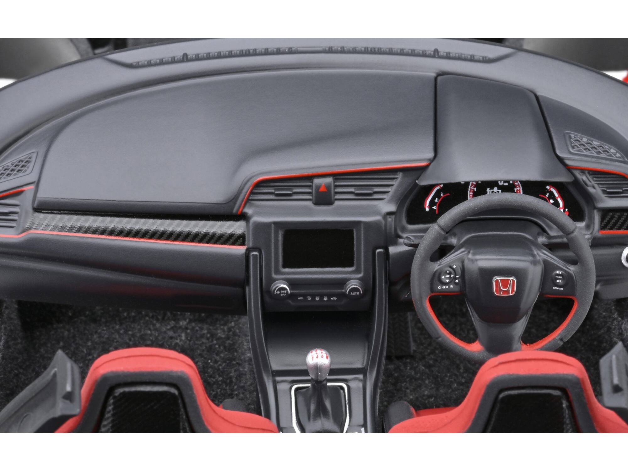 The text on the image appears to be a mix of letters and symbols that are not clearly readable. However, based on the context of a car interior, here is a possible interpretation and correction:

- "d U fch an ! ANTE -St - ovd H ! - -"

This seems to be a jumbled or distorted text. Without more context, it's difficult to accurately correct or group the text. If this is part of a larger message or code, additional information would be needed to properly interpret it.