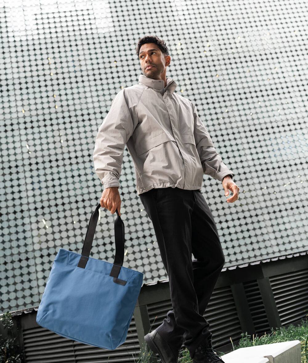 Angle. ALPAKA - Elements Tote Bag 14.5L Weatherproof Foldable Travel Tote with Magnetic Closure - Blue/G Axoflux 210D.