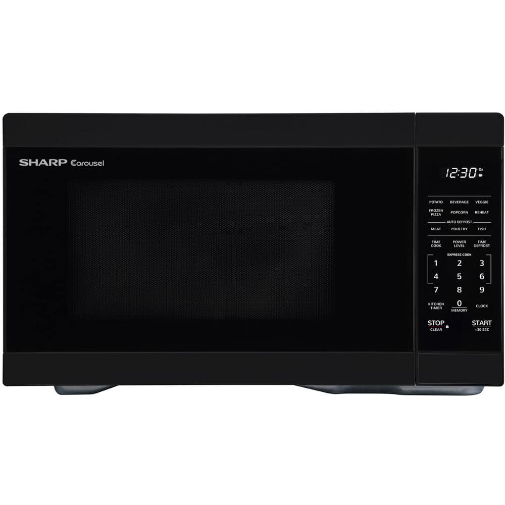 The image features a black Sharp Carousel microwave oven with a timer set at 12:30. The microwave is sitting on a countertop, and its display shows that it is currently set to defrost. The microwave has a variety of buttons on its front panel, including a stop button, a clear button, and a start button. The buttons are arranged in a row, making it easy for users to operate the microwave.