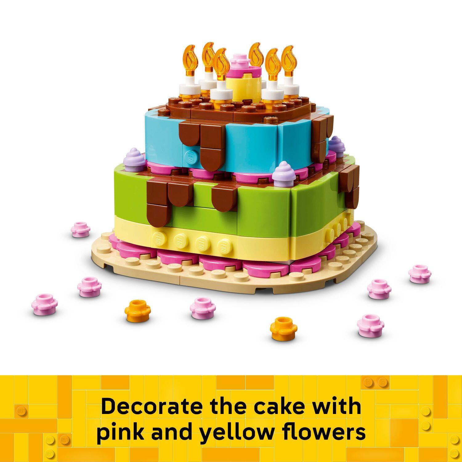 Decorate the cake with pink and yellow flowers