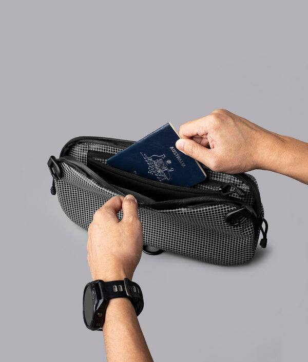 Alt View 2. ALPAKA - Lightweight Crossbody Sling Bag for Travel, Phone, Wallet & Passport, Momentum Sling, Weather-Resistant - Axodyne hybrid Grey.