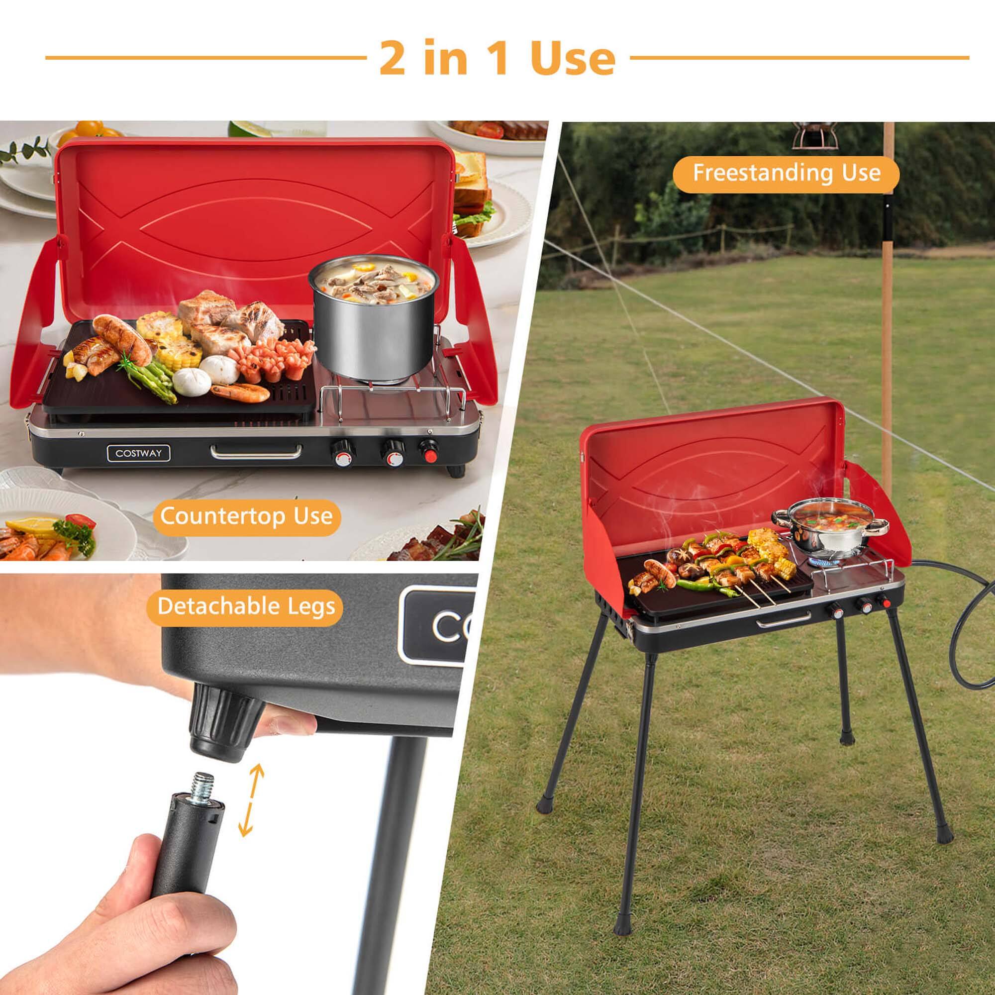 The image shows a portable grill with a detachable leg design, which can be used as a countertop grill or a freestanding grill. The grill is being used to cook food, and it is placed on a grassy field. The grill is advertised as a 2 in 1 use product, providing versatility for different cooking needs.