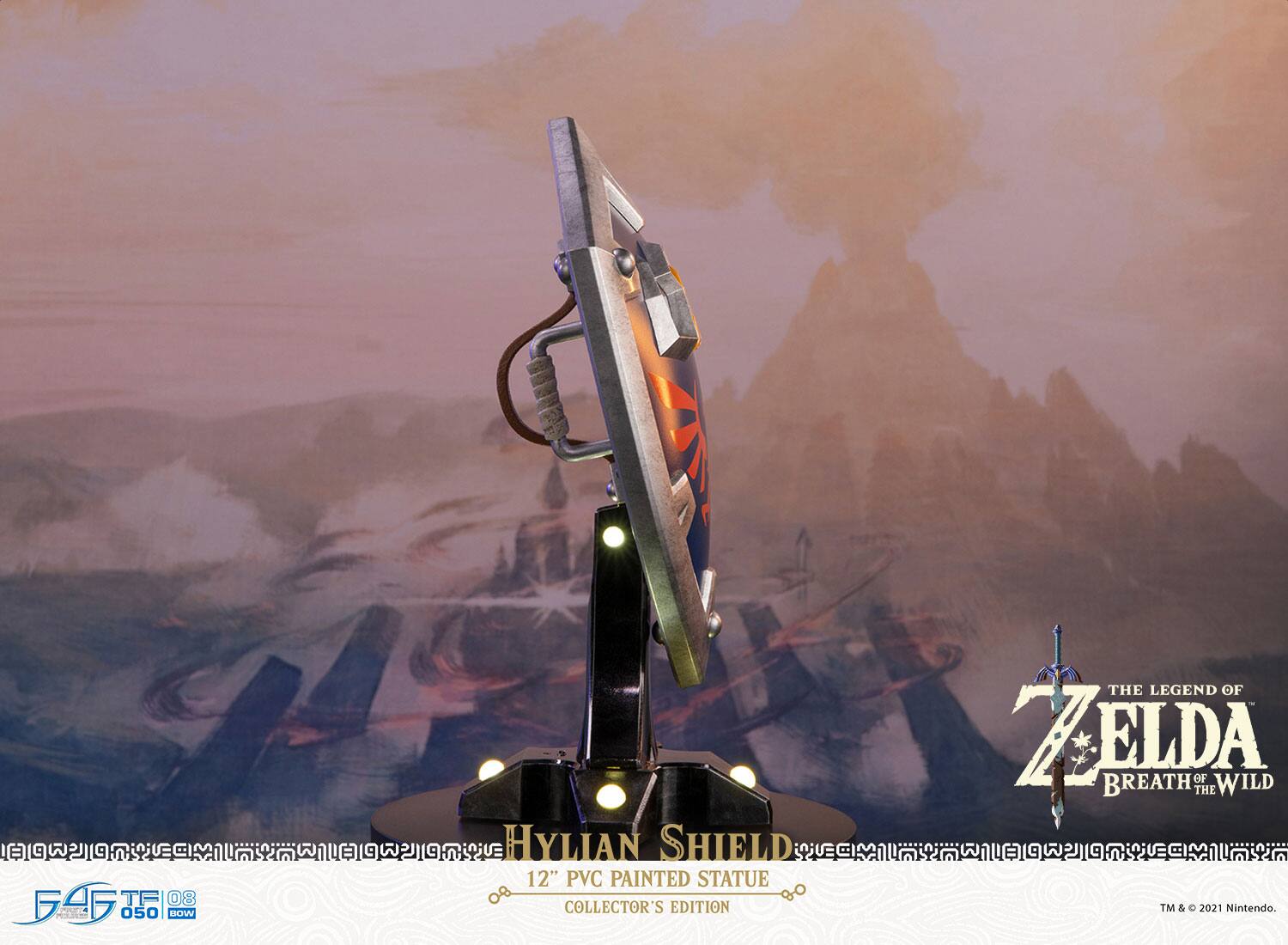 4 TF 03 0 D PT  
050 BOW  
HYLIAN SHIELD  
12" PVC PAINTED STATUE  
COLLECTOR'S EDITION  
THE LEGEND OF ZELDA  
BREATH OF WILD  
TM & © 2021 Nintendo