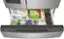 The image shows a refrigerator with a drawer full of various food items. The drawer contains a mix of fruits, vegetables, and other food items. Some of the items include apples, broccoli, and a few bottles. The refrigerator is stocked with a variety of foods, making it a convenient and healthy option for meal preparation.