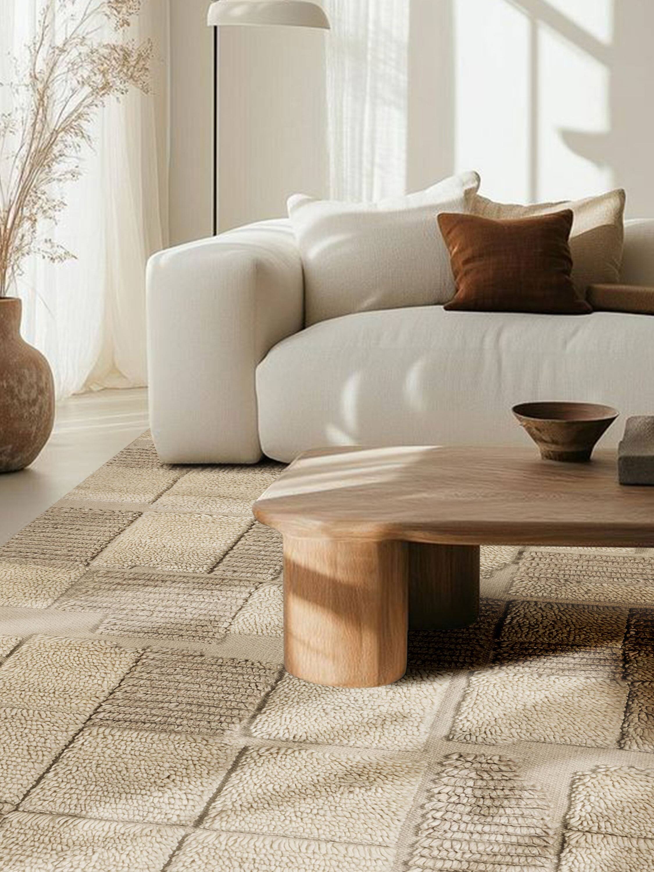 Left. GAURI KOHLI - Winnipeg Rug - Shades of ivory, beige and taupe.