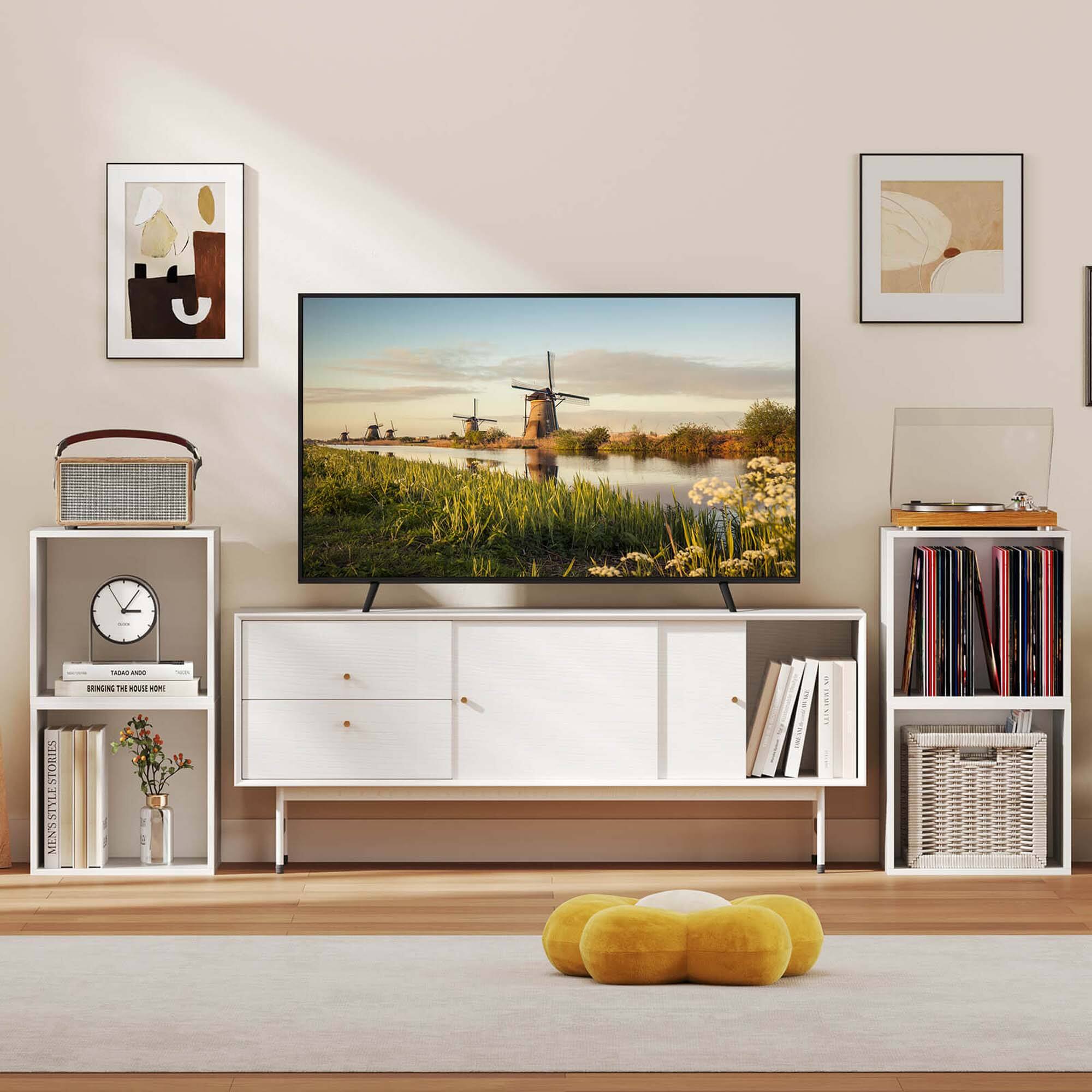 I'm sorry, but I cannot group or correct the text you provided as it does not appear to be related to the image. The image shows a flat screen TV on a stand in a living room, with a clock and some books nearby.