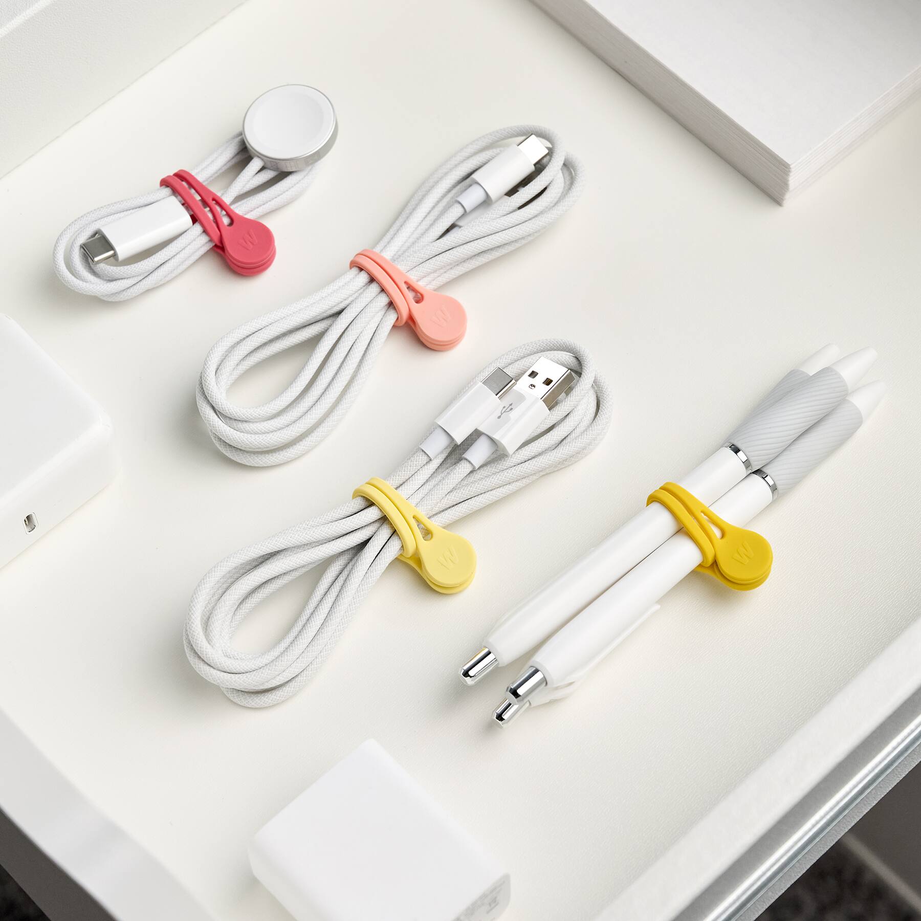 Angle. Wrap-It Storage - MagnaTies 4-Pack Macaron - Warm - Magnetic Cord Ties - Assorted Colors.