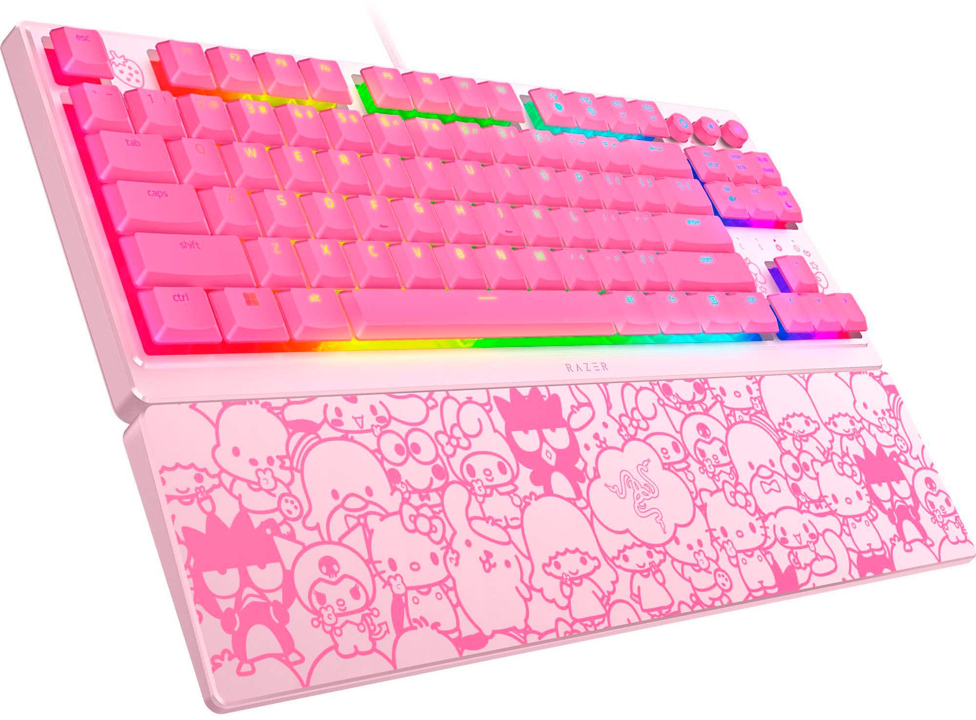 The text on the image reads "RAZER" and is likely referring to the company that manufactures the keyboard. The keyboard itself is pink and white, with a design featuring cartoon characters. The keys are also colorful, adding to the overall aesthetic of the keyboard.