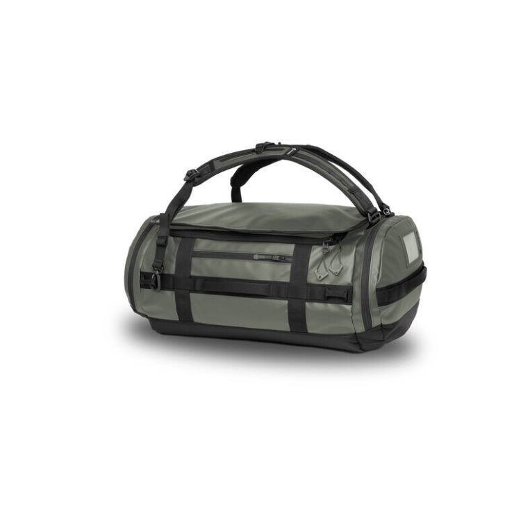 Left. WANDRD - WANDRD CARRYALL Duffel with Expandable Bottom Compartment (Wasatch Green, 40L) - Green.