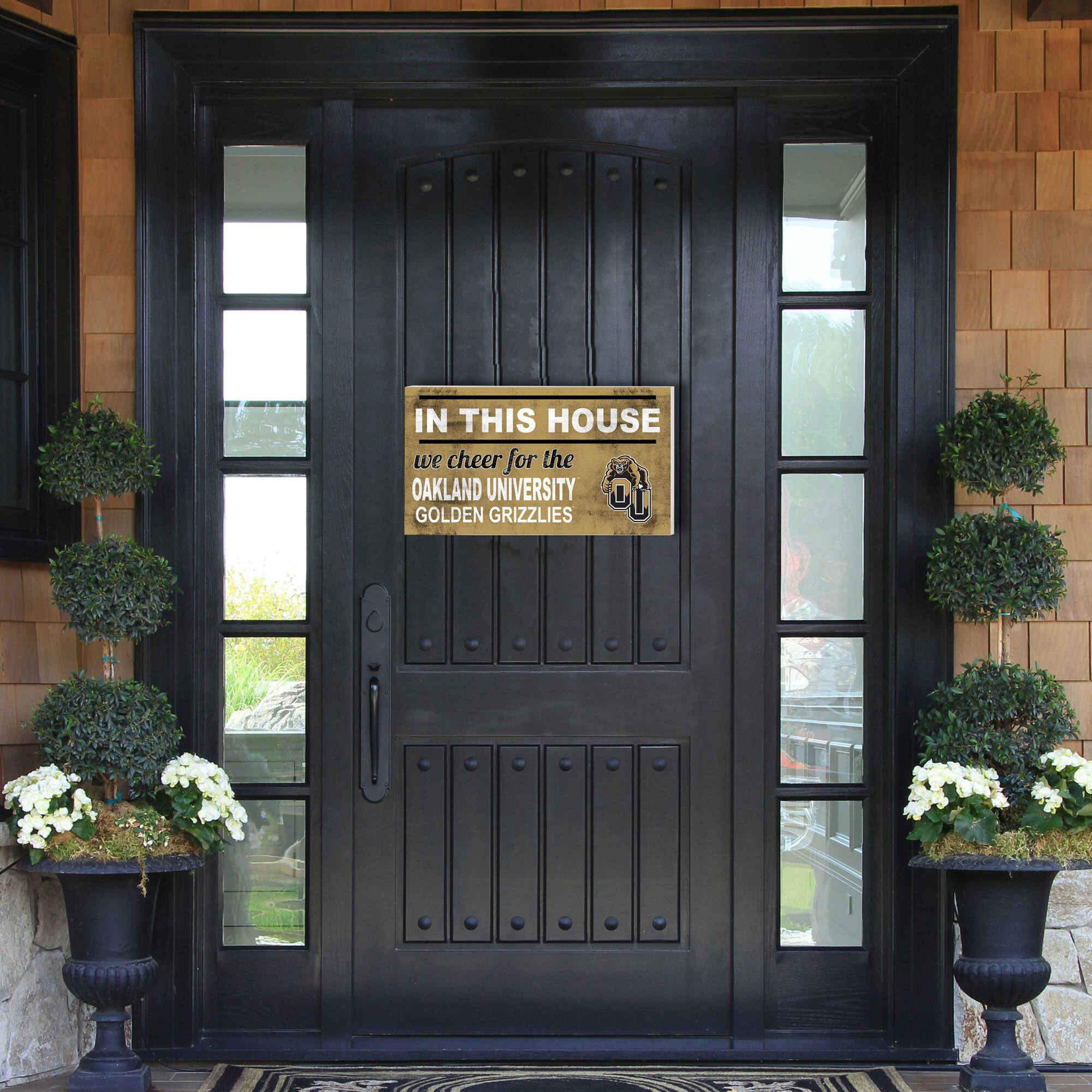 IN THIS HOUSE  
we cheer for the  
OAKLAND UNIVERSITY  
GOLDEN GRIZZLIES