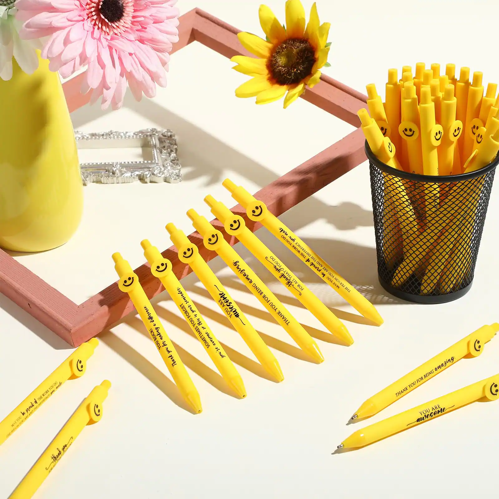 Sure, here is the corrected and grouped text from the image:

---

**On the Pens:**
- "THANK YOU FOR RING RANGING"
- "YOU ARE AWESOME"

**On the Frame:**
- "THANK YOU FOR RING RANGING"
- "YOU ARE AWESOME"

**On the Vase:**
- "THANK YOU FOR RING RANGING"
- "YOU ARE AWESOME"

**On the Cup:**
- "THANK YOU FOR RING RANGING"
- "YOU ARE AWESOME"

---

This text is consistent across all the items in the image.