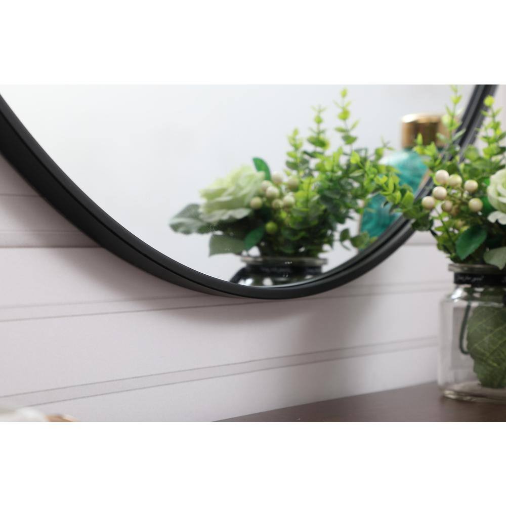 Left. Elegant Decor - Metal frame round mirror with decorative hook 39 inch in Black - Black.