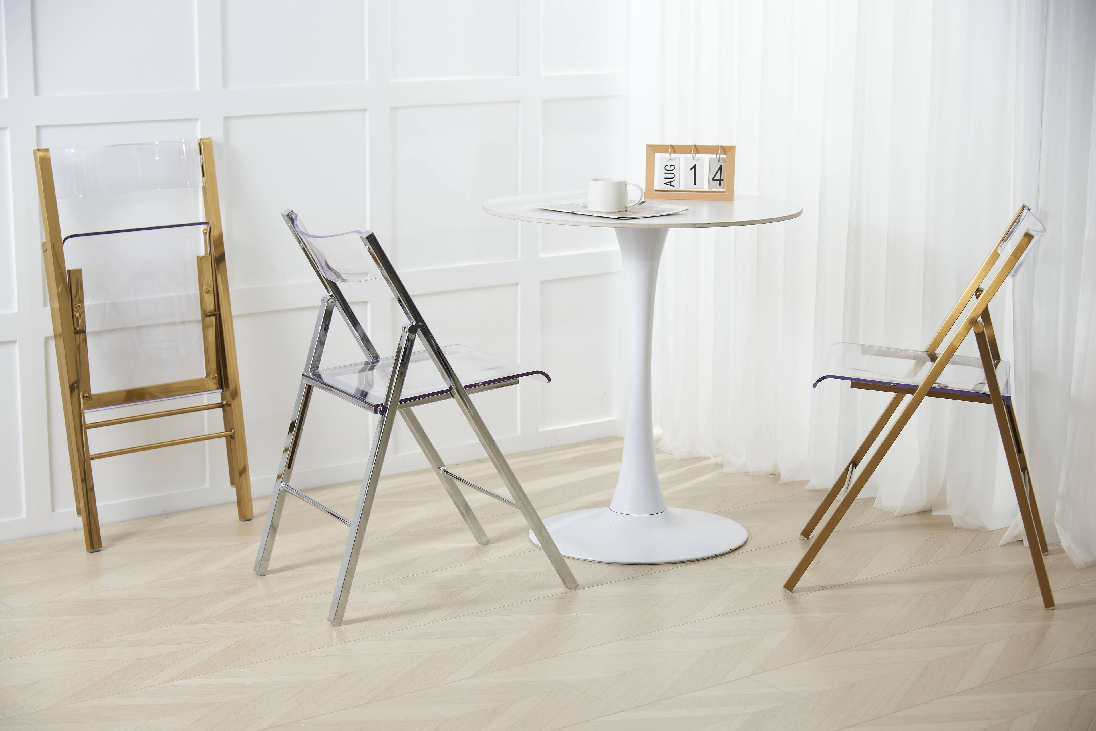 Left. LeisureMod - Menno Brushed Gold Acrylic Folding Dining Chair with Waterfall Seat & Stainless Steel Frame - Set of 2.