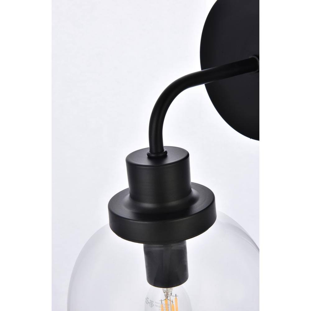 Back. Living District - Hanson 1 light bath sconce in black with clear shade - Black And Clear Shade.