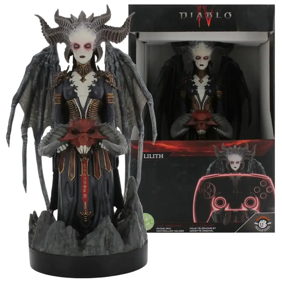 The image features a statue of Lilith, a character from the Diablo video game series. The statue is posed with a demonic appearance, wearing a black dress and holding a red skull. The statue is placed next to its original packaging, which includes a phone and controller. The packaging also has a warning label, indicating that it is not a toy and should be handled with care.