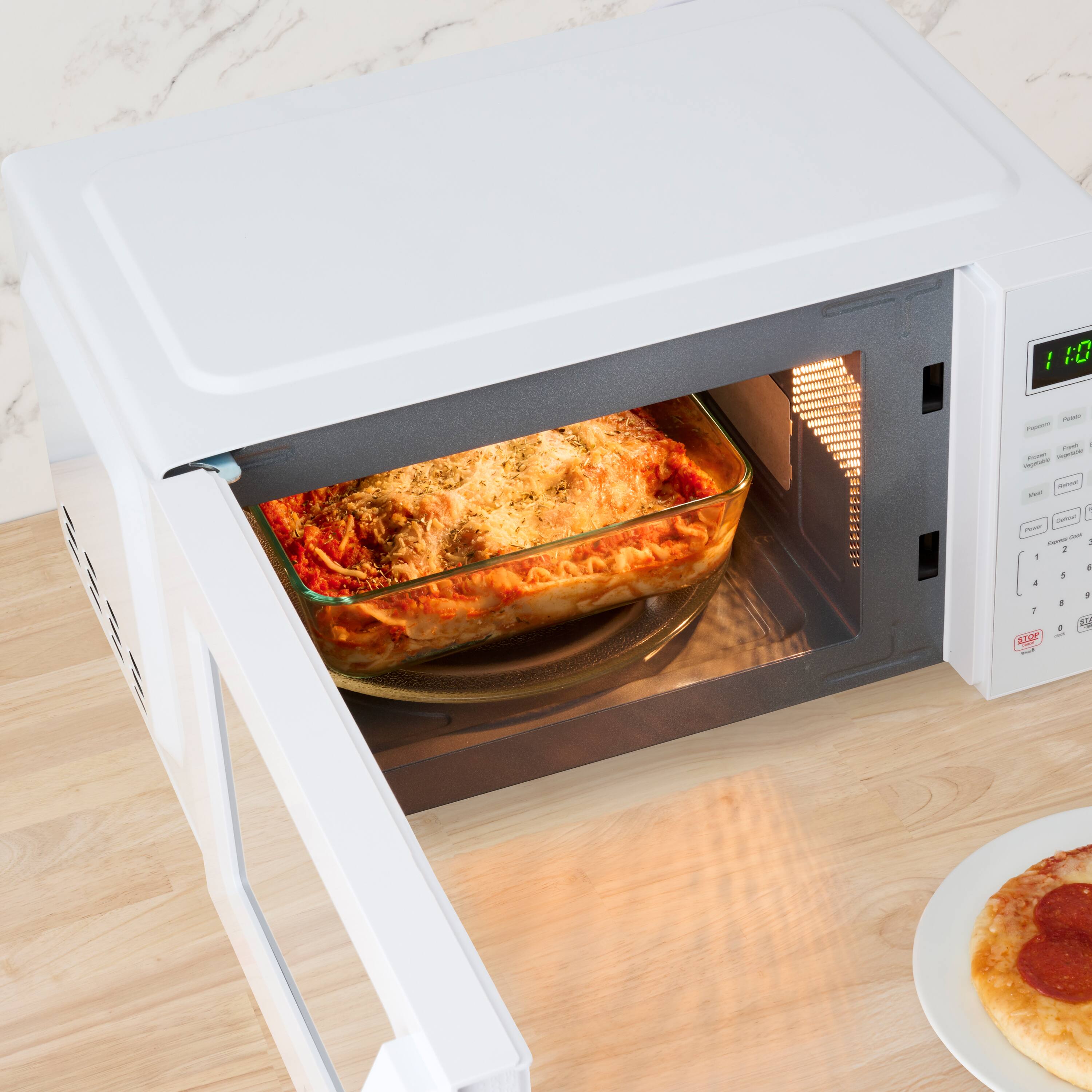 Alt View 4. Farberware - Farberware 700-Watt Compact Countertop Microwave Oven – 0.7 cu. ft., White - White.