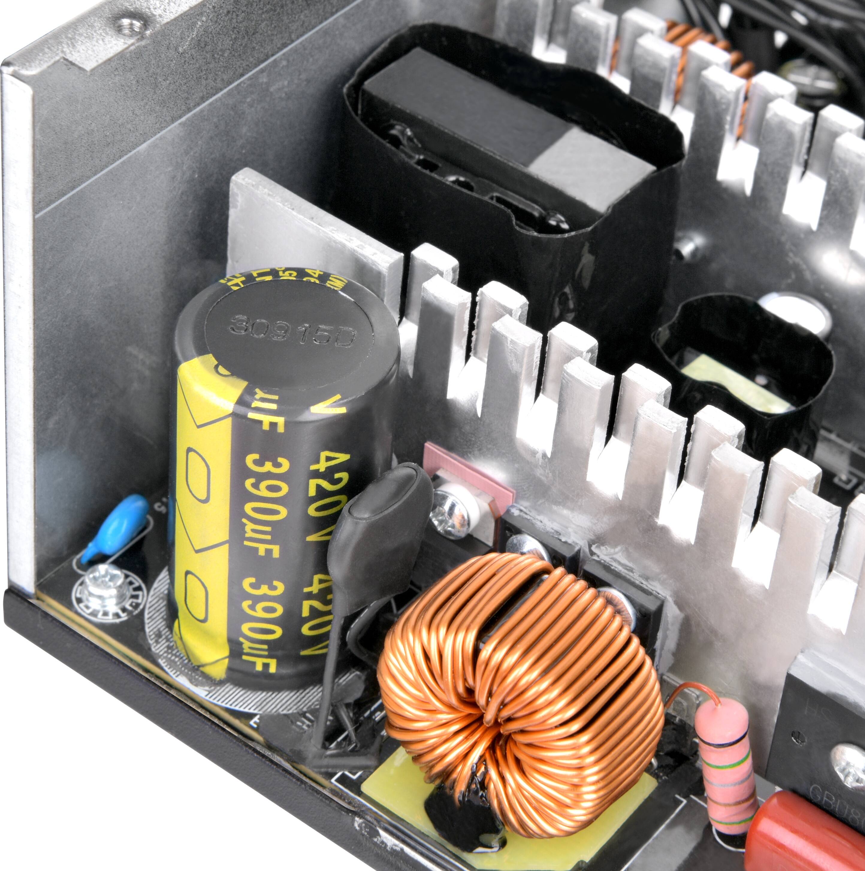 The text on the image reads: "309150 uF - 390uF 420V 390F D GRU8." This text is likely related to the electronic components inside the box. The text may indicate the capacitance, voltage, and other specifications of the components.