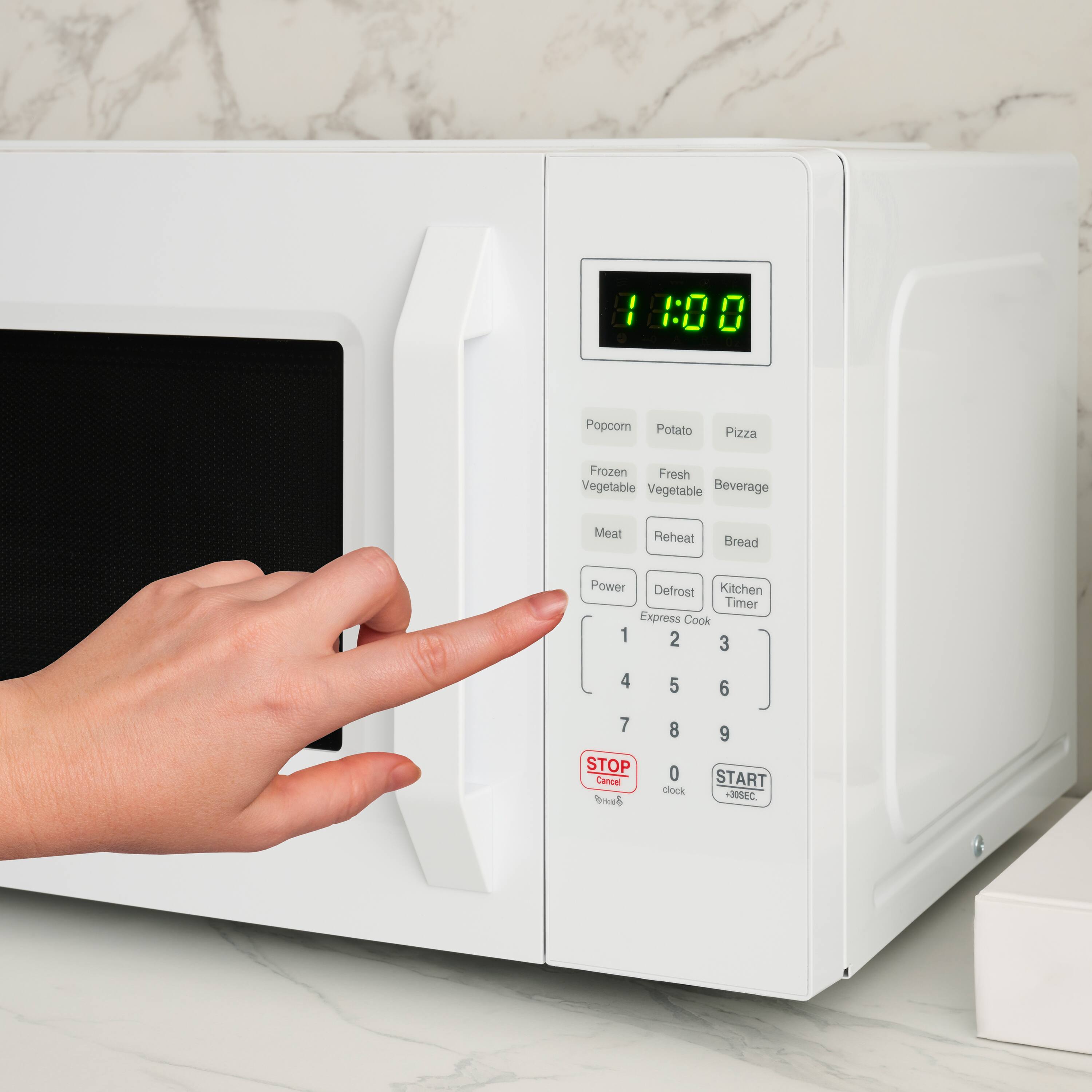 18:00 0 Popcorn Potato Pizza Frozen Fresh Vegetable Vegetable Beverage Meat Reheat Bread Power Defrost Kitchen Timer Express Cook 1 2 3 4 5 6 7 STOP Cancel 8 0 clock 9 START -305C