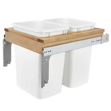 The image shows a dual sink setup with a wooden countertop. The sinks are white and rectangular, and the base is white with metal hinges and a control panel on the side.