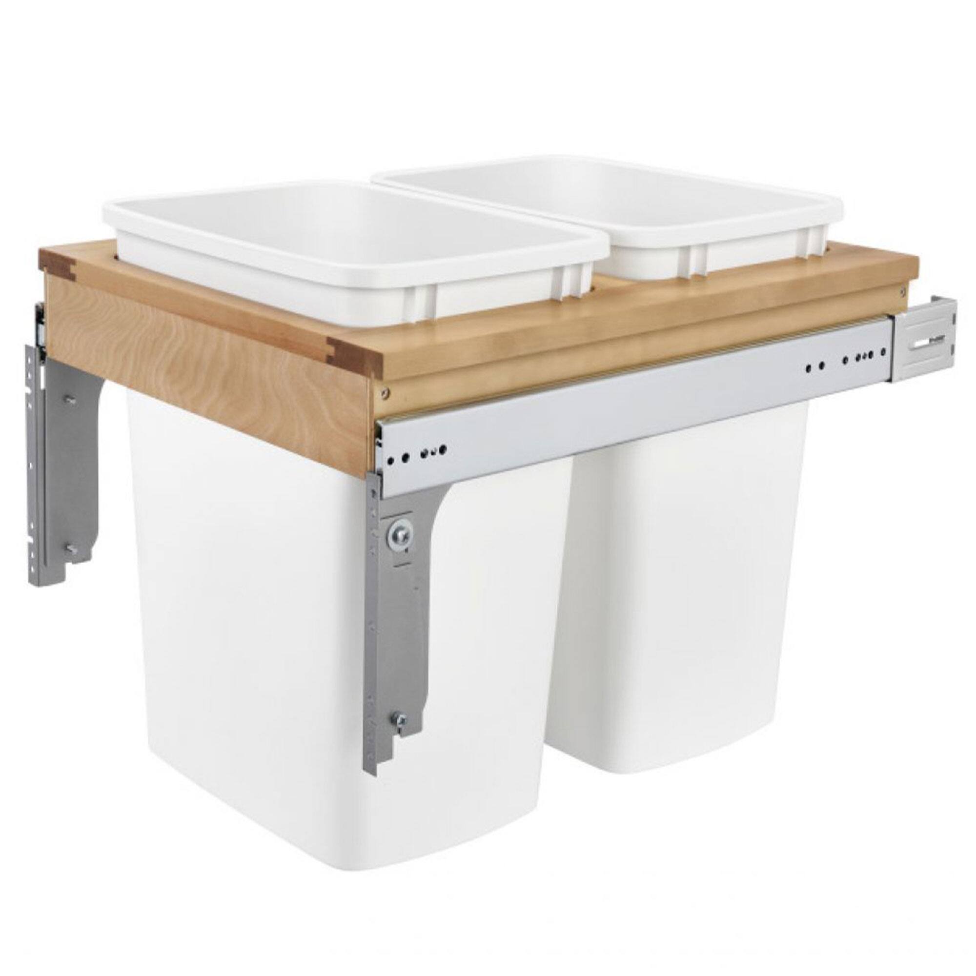 The image shows a dual sink setup with a wooden countertop. The sinks are white and rectangular, and the base is white with metal hinges and a control panel on the side.