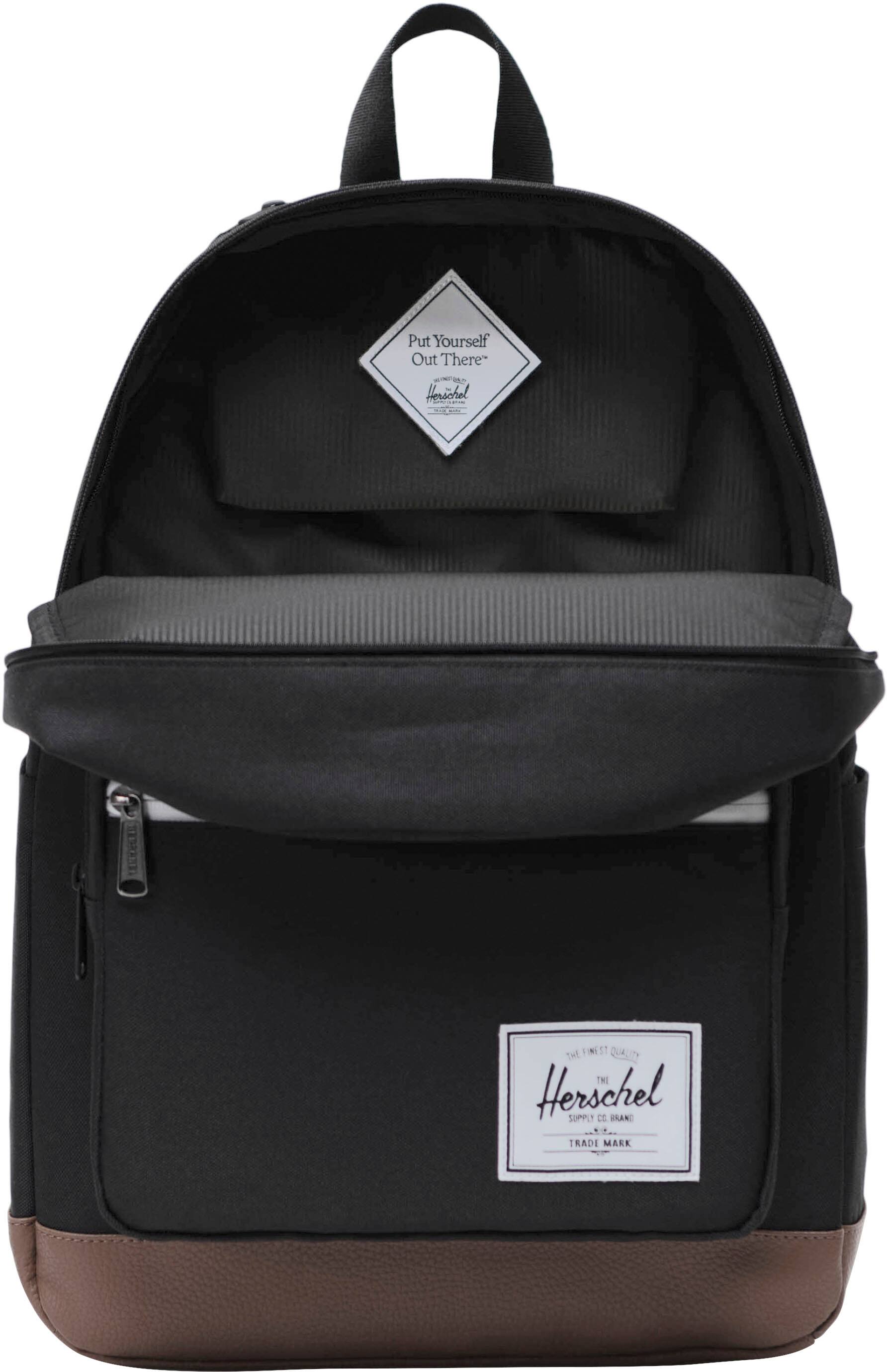 Herschel Supply Co. is a brand that offers high-quality products, including backpacks. The image features a black and brown Herschel backpack with a white tag. The backpack is designed to be functional and stylish, making it a popular choice among consumers.