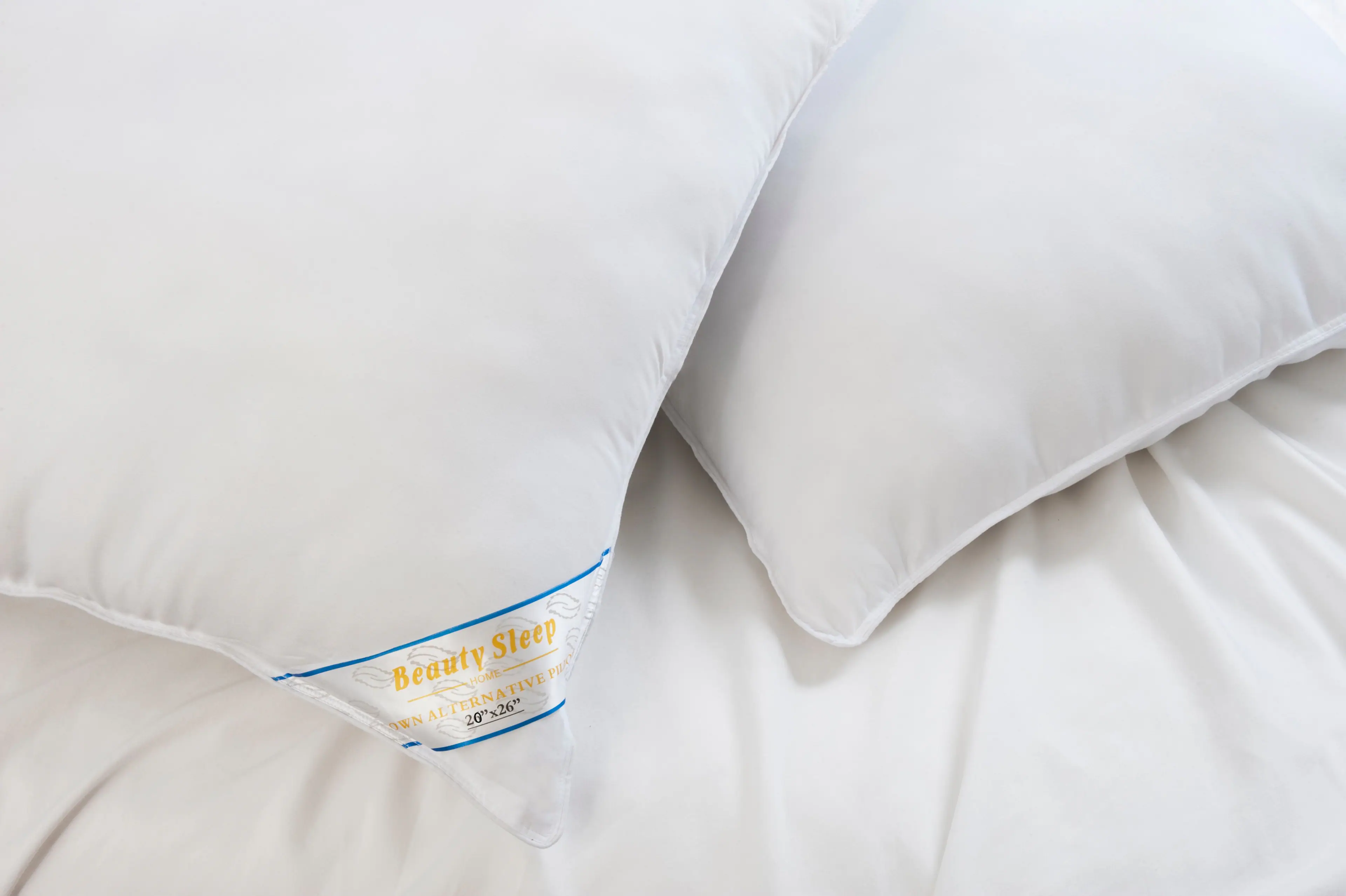 The text on the image is: "Beauty Sleep HOME ALTERNATIVE PILLOW 20"x26" DOWN ALTERNATIVE"