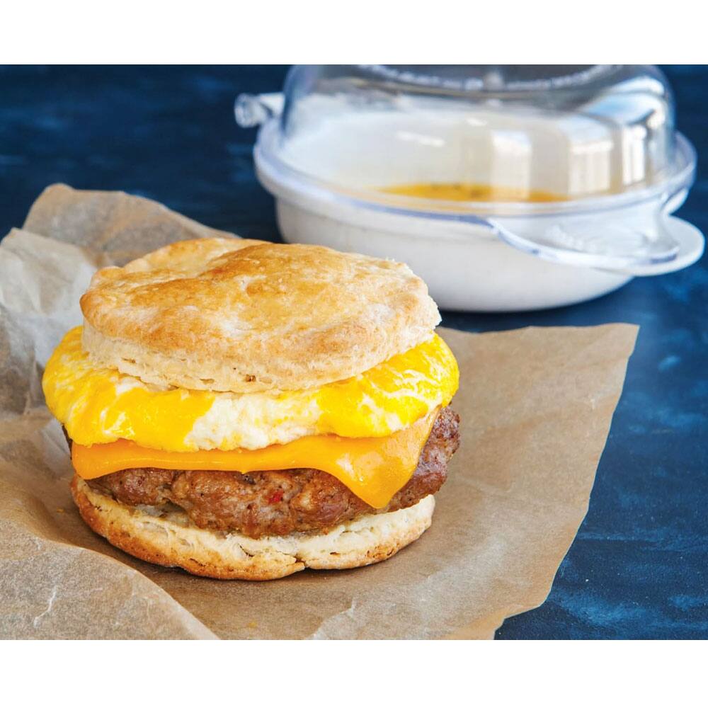 Left. Nordicware - Microwavable Egg and Muffin Breakfast Pan - White base/clear lid.