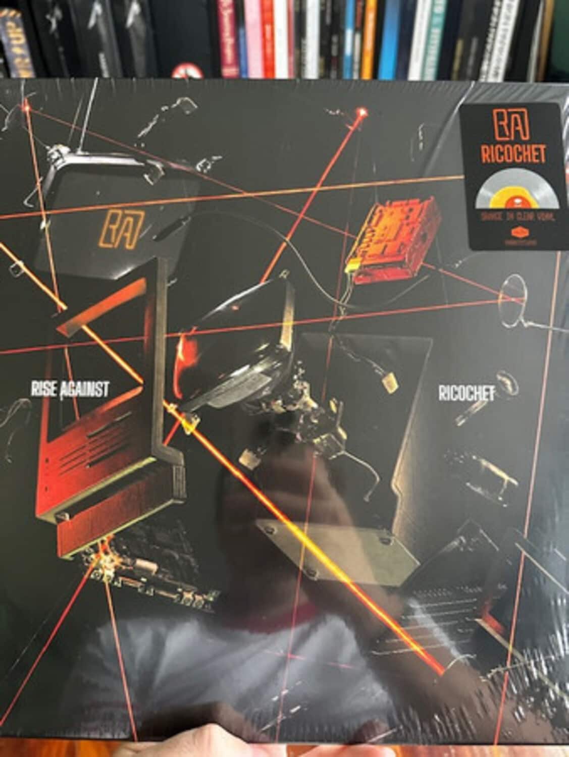 Rise Against - Ricochet - Limited Colored Vinyl with Opaque Orange Center & Clear Outside   - VINYL LP price history on PriceWatchPro