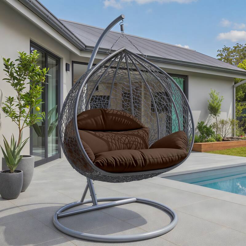Angle. LeisureMod - Recluse Grey Wicker Hanging Egg Chair - Modern Indoor Outdoor Swing with Stand, 440lb Capacity - Brown.