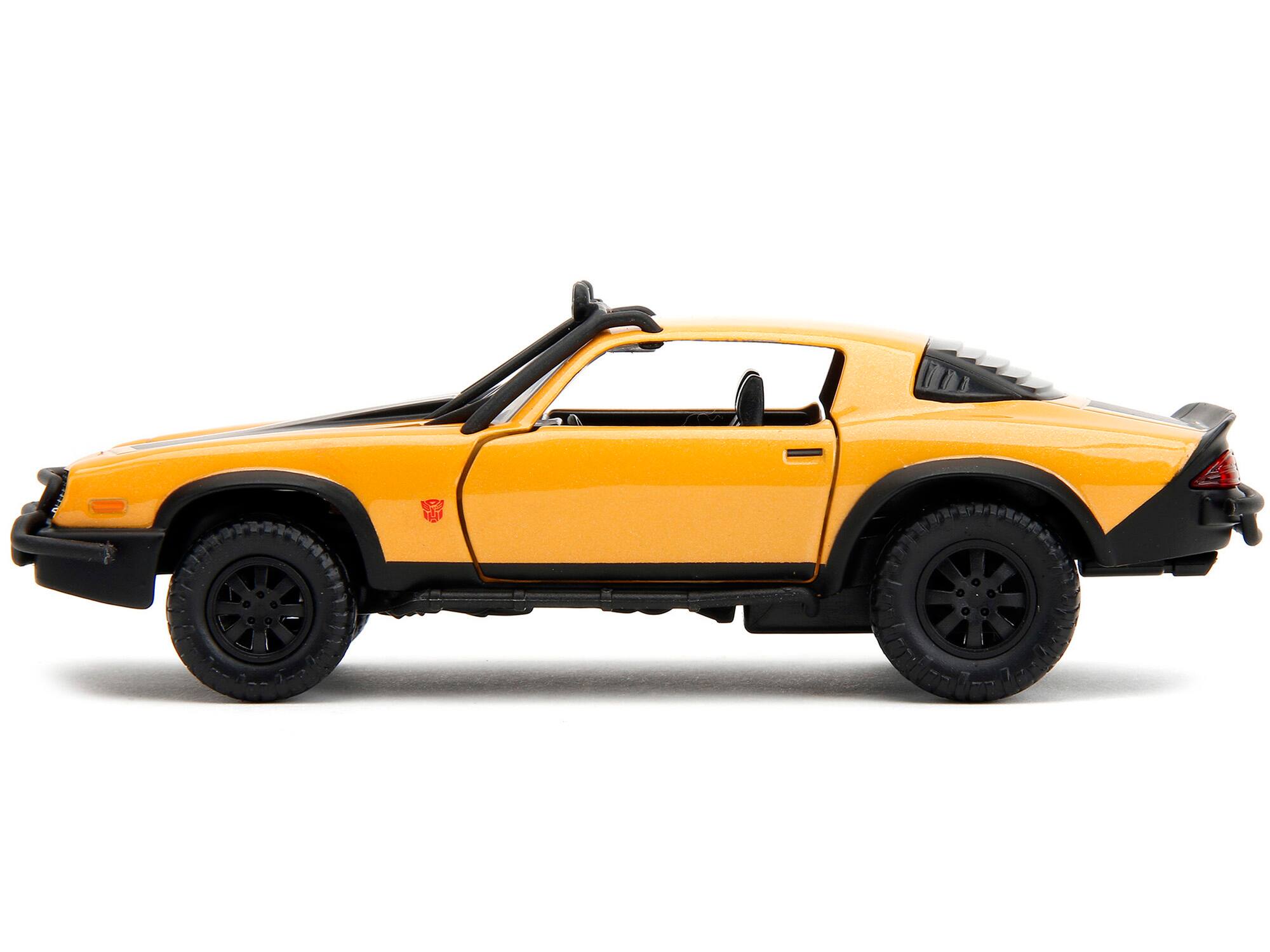 Left. Jada - 1977 Chevrolet Camaro Off-Road Yellow Metallic Black Stripes Transformers Rise of the Beasts 2023 Hollywood Rides 1/32 - Yellow Metallic With Black.