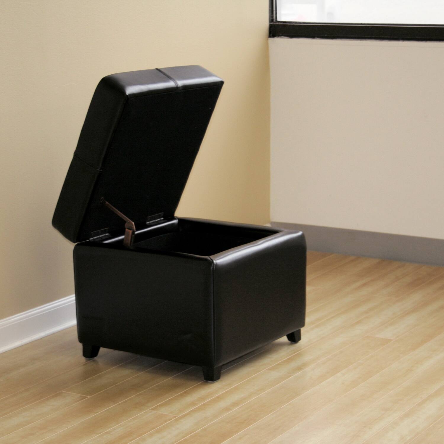 Left. Baxton Studio - Full Leather Storage Cube Ottoman - Black.