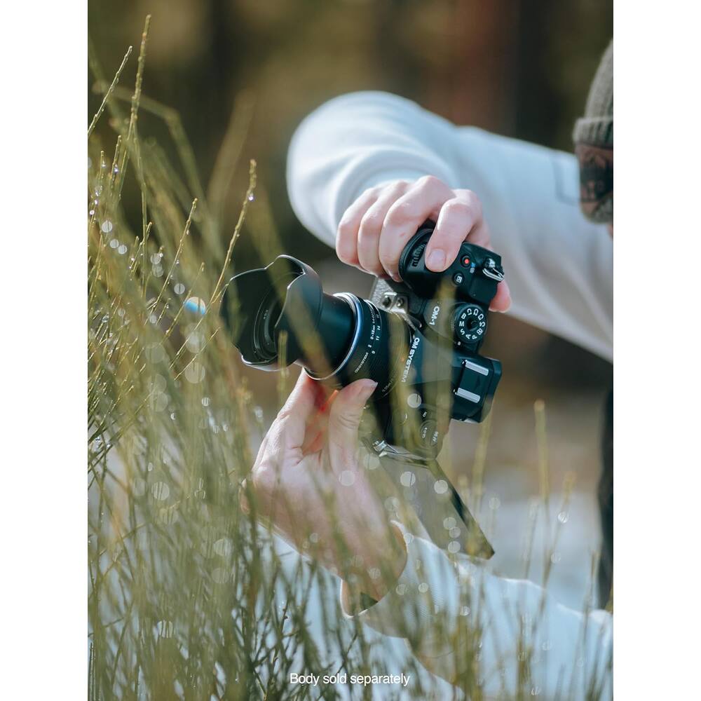 a ! : I OM-1 OM SYSTEM a 1 8 0 M 1 4y F . Body sold separately