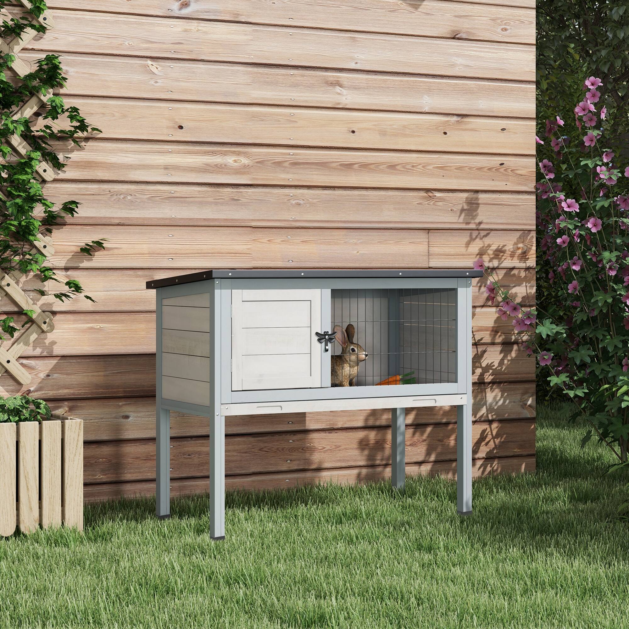Angle. Pawhut - Elevated Wooden Rabbit Hutch, Indoor/Outdoor Bunny Cage with Hinged Asphalt Roof and Removable Tray.