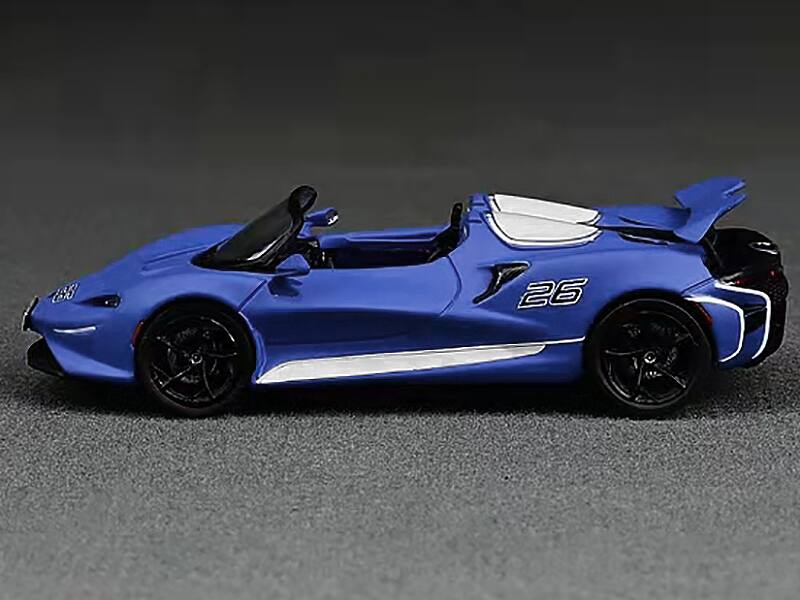 Alt View 1. CM Models - McLaren Elva Convertible #26 Matt Blue with White Stripes and Extra Wheels 1/64 Diecast Model Car by CM Models.