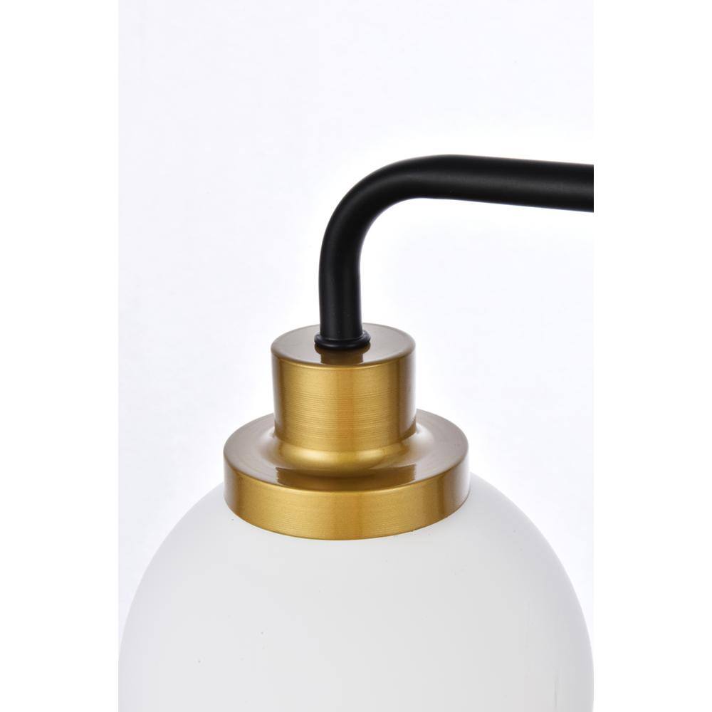 Left. Living District - Hanson 3 lights bath sconce in black with brass with frosted shade - Black And Brass And Frosted Shade.