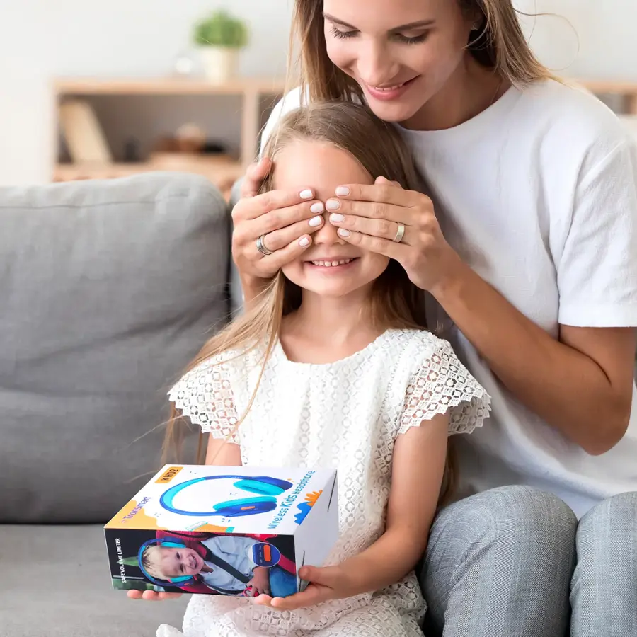 The text on the image reads "DOA - Tronsmart LIITER & YOU Kids Grb5/adsiane Mireless." This is a description of a product, likely a children's headphones or earbuds, which is being held by a woman and a young girl. The product is designed for kids and is wireless, making it a convenient and safe option for children to use.