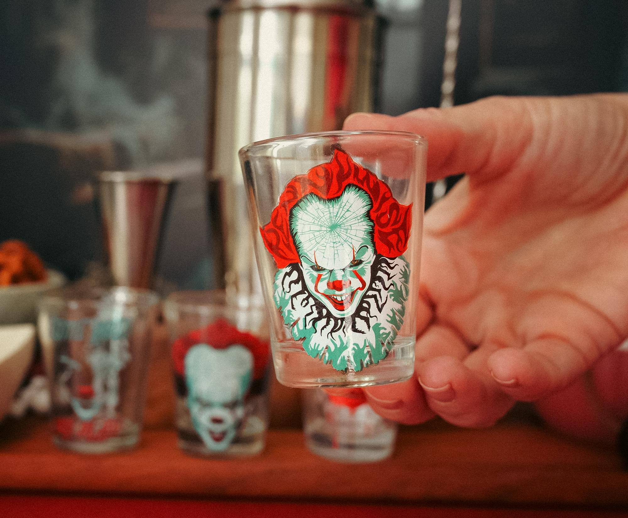 Alt View 2. Silver Buffalo - IT Pennywise 2-Ounce Mini Shot Glasses | Set of 4 - Red.
