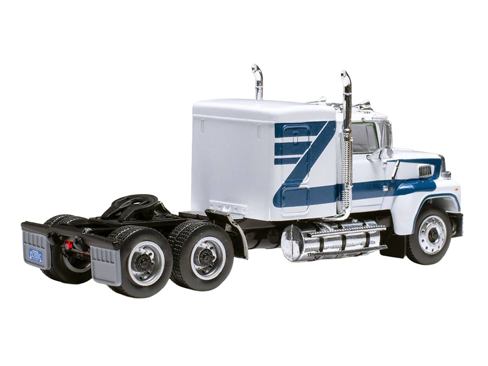 Left. IXO - 1978 Ford LTL 9000 Truck Tractor White with Blue Stripes 1/64 Diecast Model by IXO Models - White and Blue.