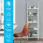 The image features a modern and stylish living space with a chair, a bookshelf, a desk, and a sink. The bookshelf is filled with various books, and the chair is positioned in front of the bookshelf. The desk is located next to the bookshelf, and the sink is situated nearby. The living space is designed with a simple and elegant aesthetic in mind, making it easy to clean and maintain. The multiple function round corner design adds a unique touch to the space, enhancing its overall appeal.