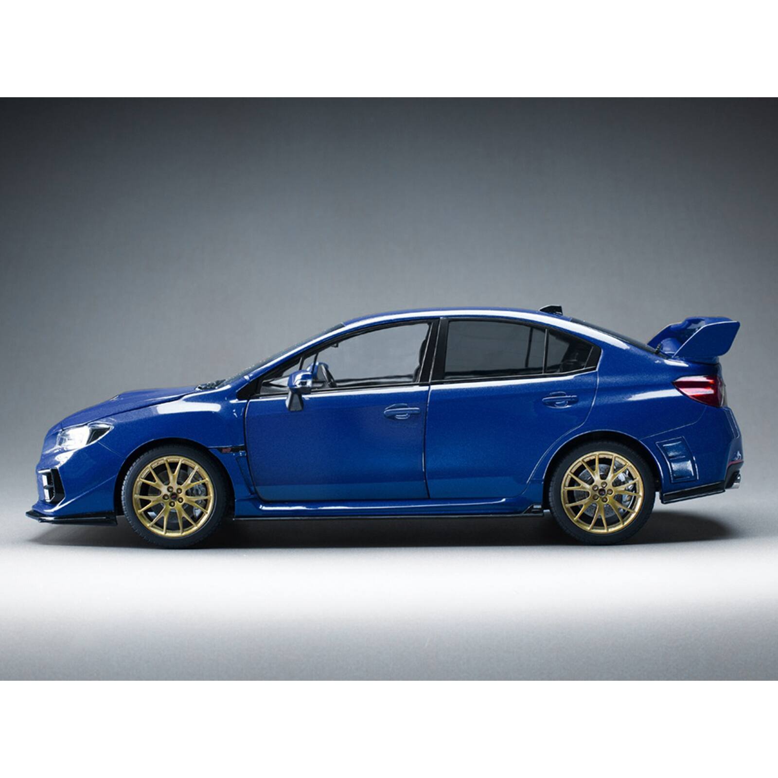 Alt View 4. Sun Star - Subaru WRX STI EJ20 Final Edition RHD (Right Hand Drive) Blue Metallic with Gold Wheels 1/18 Diecast Model by Sun Star.