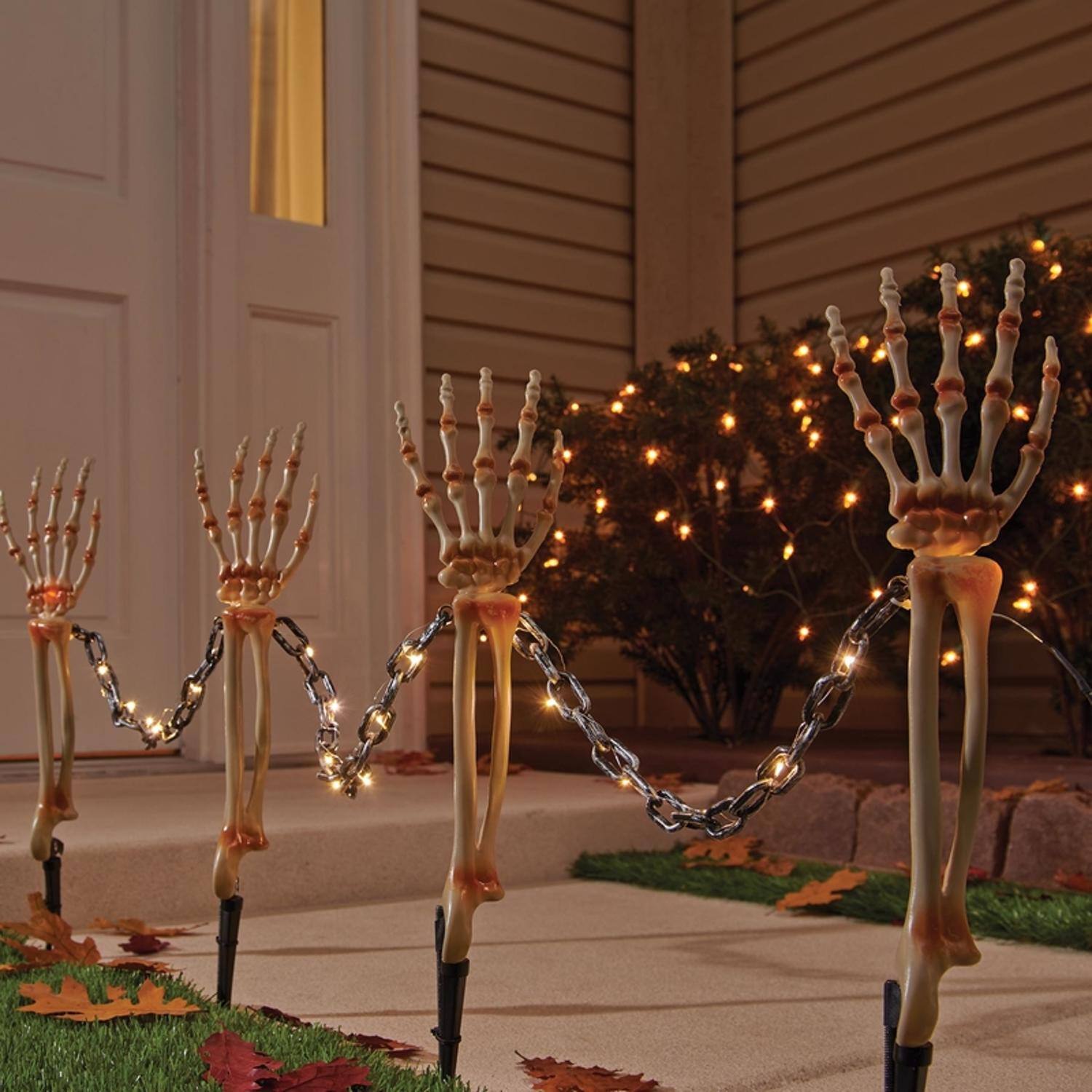 Front. Celebrations - Celebrations Halloween Warm White 18 in. LED Prelit Chained Skeleton Arms Pathway Decor - Multicolored.